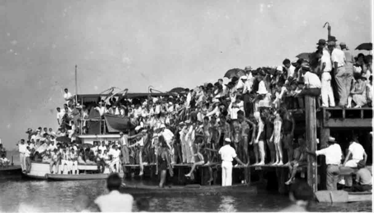 Isle-of-Caprice.-View-of-large-group-of-people-at-waterfront.